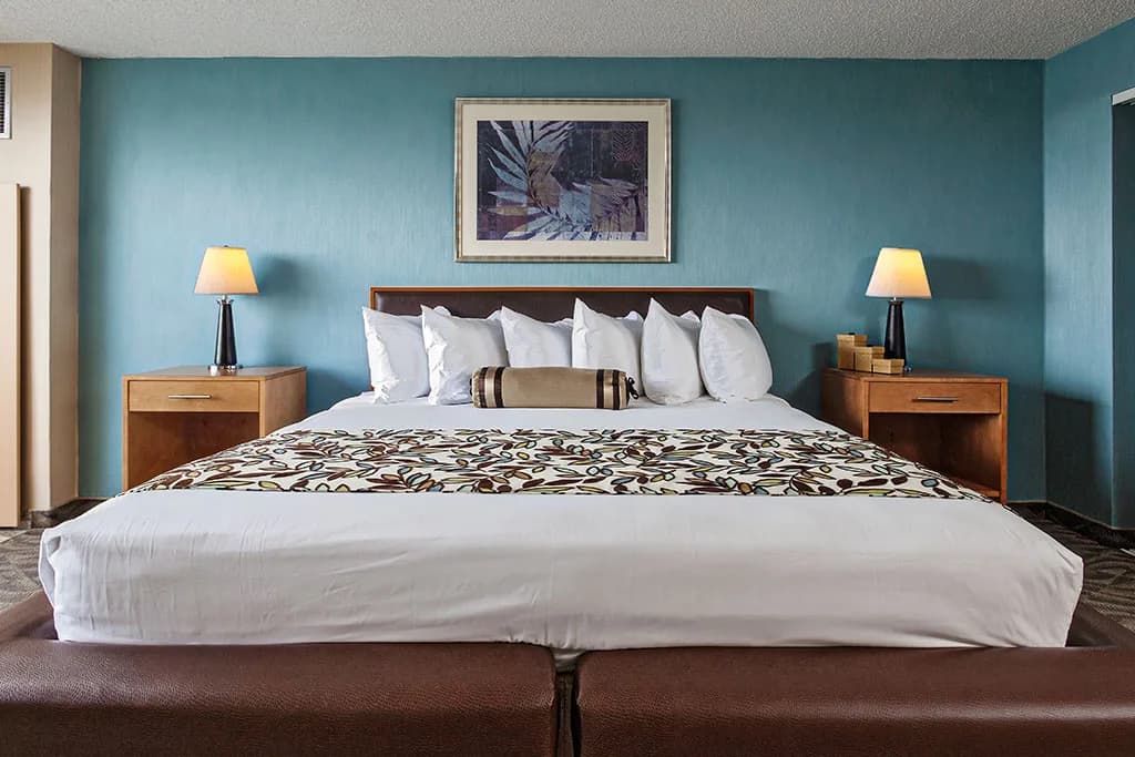 King bed in a suite at the Flagship Resort