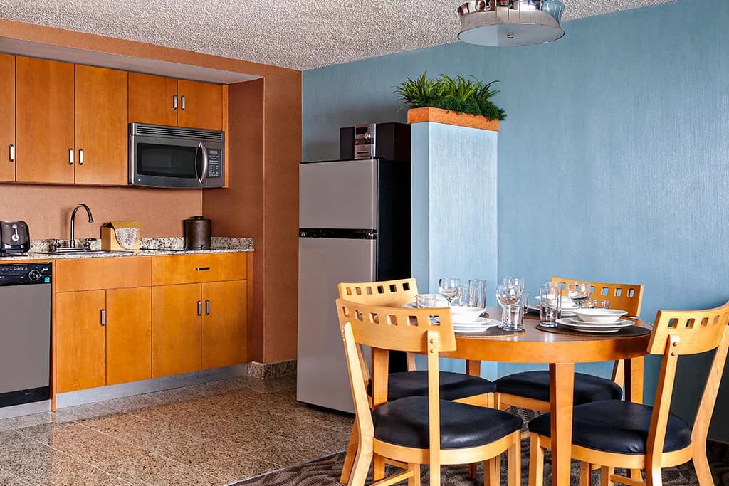 Kitchenette and dining table inside a Flagship Resort suite